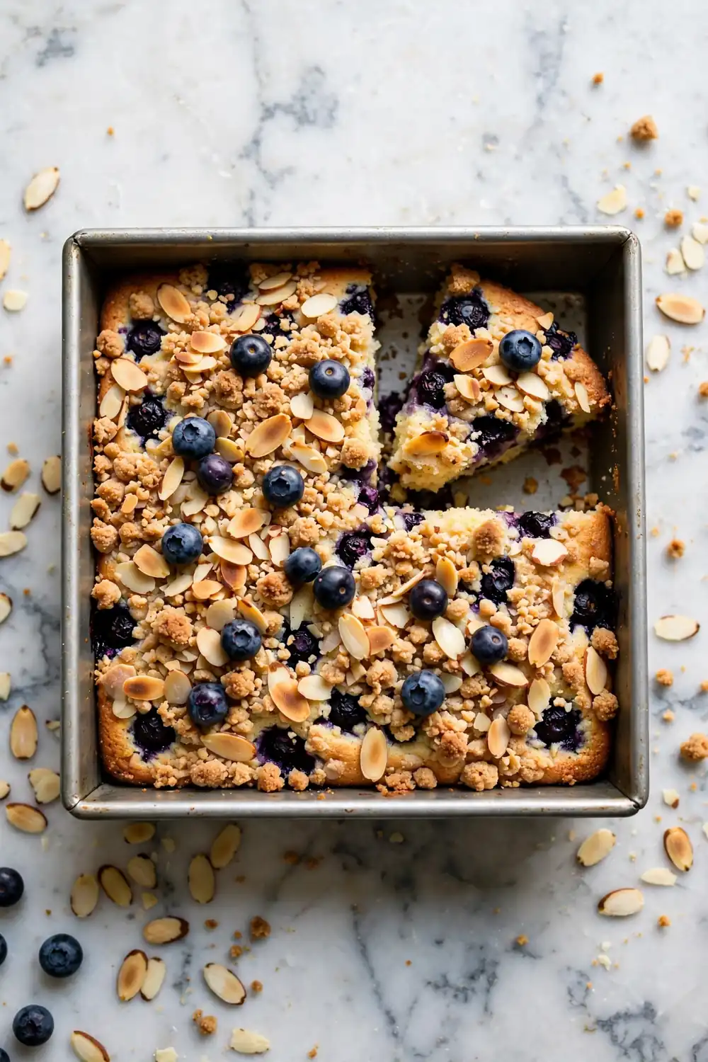 Blueberry crumb cake with almond streusel in a square pan