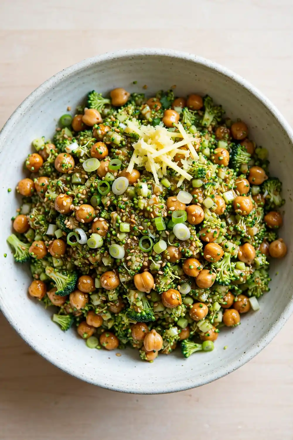 Chopped broccoli and chickpea salad with sesame ginger dressing and scallions