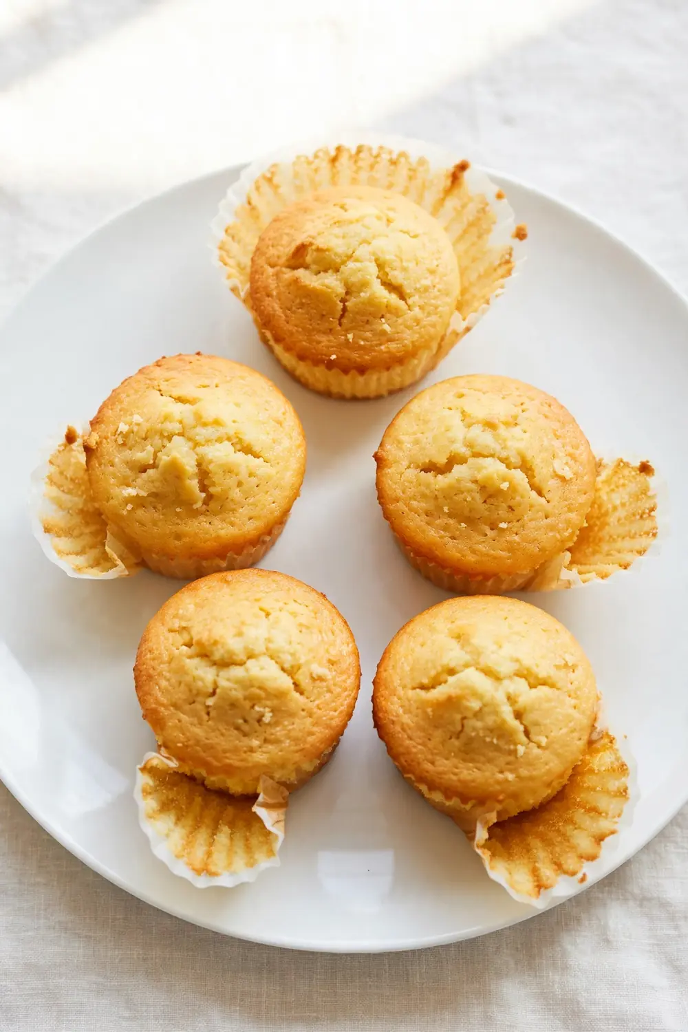 Clean cupcakes with liners peeling off neatly on a plate