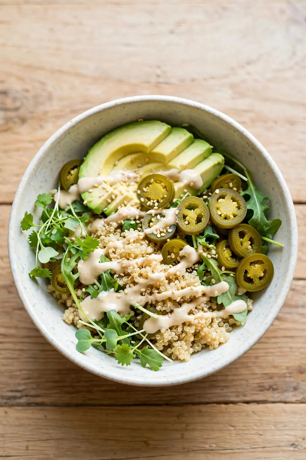 Grain bowl with jalapeno coins and avocado