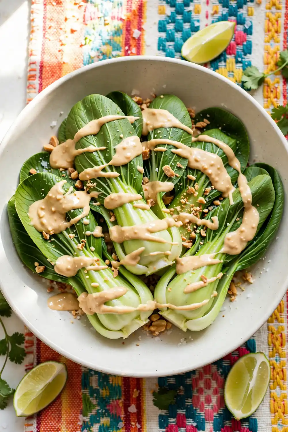 Bok choy with peanut lime sauce and crushed peanuts