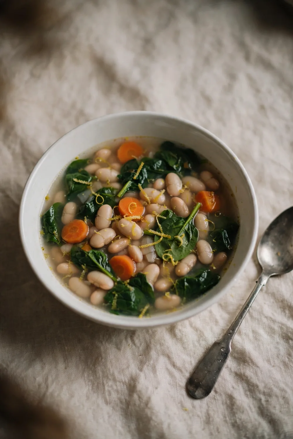 Simple weeknight bean soup in a plain white bowl