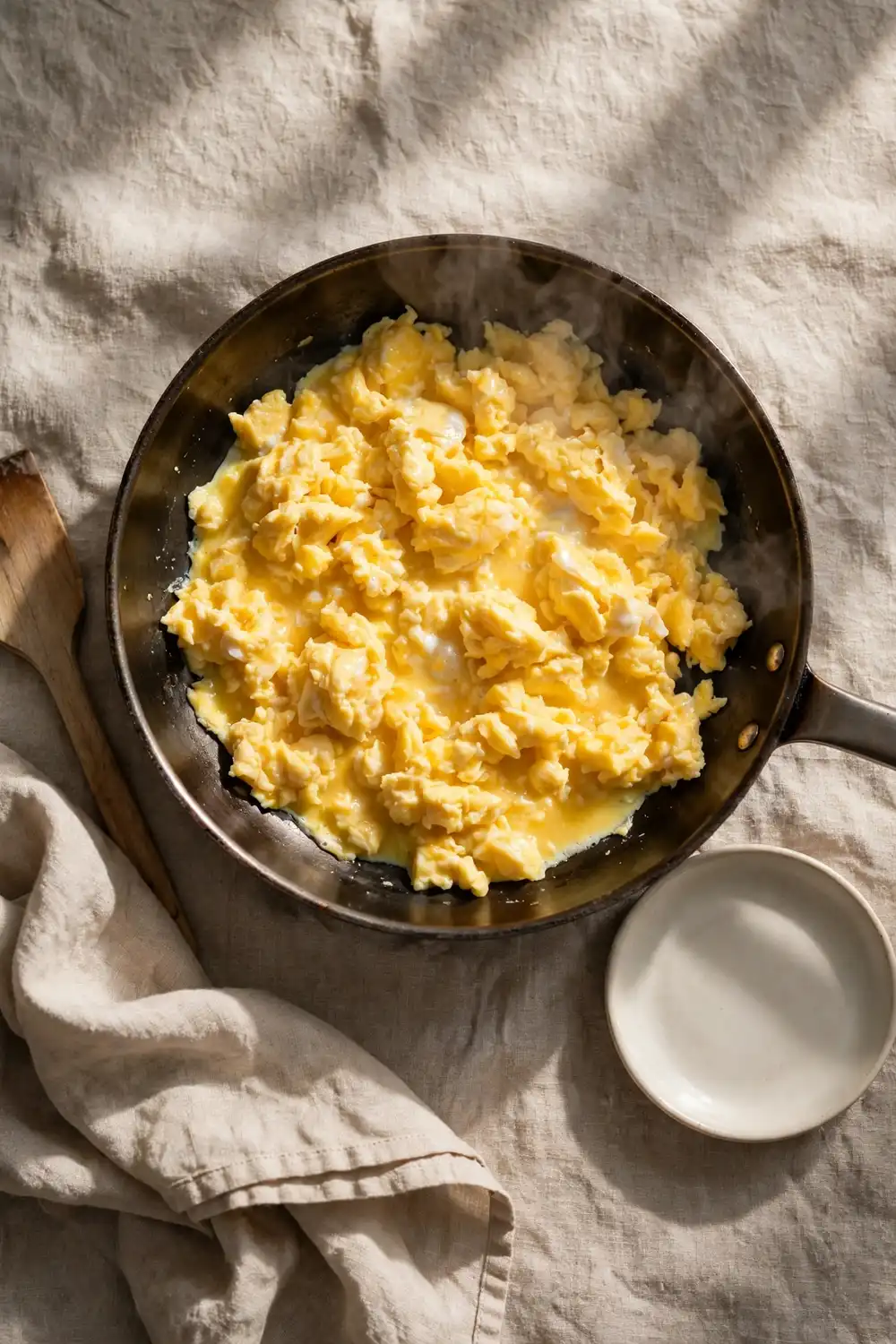 Scrambled eggs cooked gently in a pan